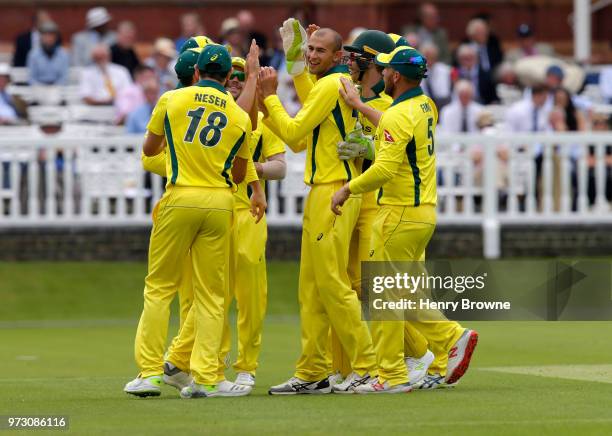 Ashton Agar celebrates with tream mates after taking the wicket of Stevie Eskinazi of Middlesex during the One Day Tour match between Middlesex and...