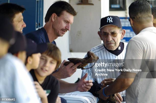 New York Yankees' pitcher Randy Johnson talks with former Yankees' catcher and manager Yogi Berra during 59th annual Old-Timers' Day festivities at...