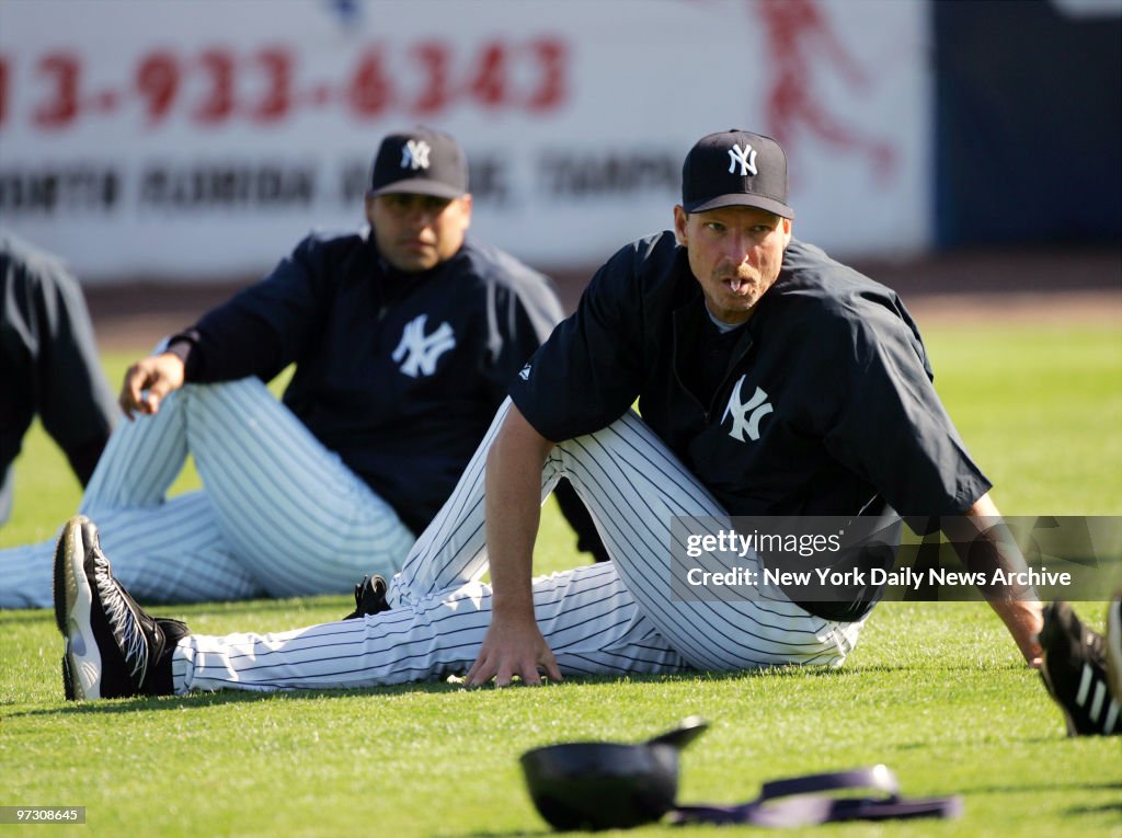 New York Yankees' pitcher Randy Johnson (right) stretches du