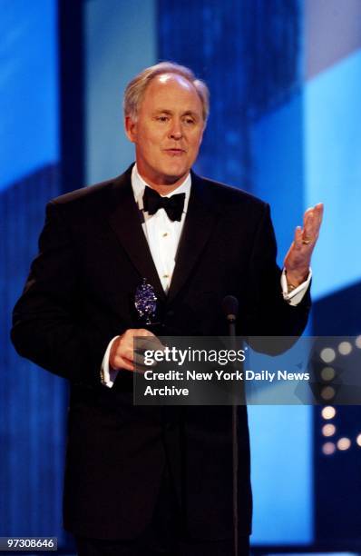 John Lithgow accepts the award for Best Leading Actor in a Musical for "Sweet Smell of Success" at the 56th annual Tony Awards at Radio City Music...