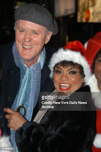 John Lithgow and Eartha Kitt are all aglow at the lighting of the Broadway Christmas tree in Duffy Square.