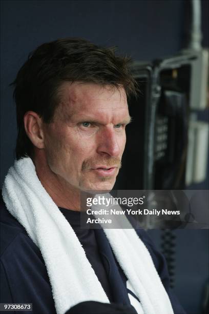 New York Yankees' pitcher Randy Johnson cools off in the dugout after pitching batting practice during a full squad workout at Legends Field, the...