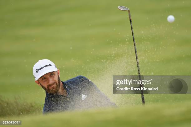 Dustin Johnson of the United States plays a shot from a bunker on the 11th hole during a practice round prior to the 2018 U.S. Open at Shinnecock...