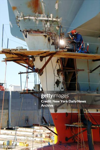 Sparks fly as a workman crafts the new Navy warship USS New York, which is partially fashioned with steel salvaged from the World Trade Center site,...