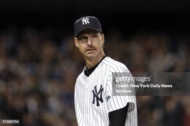 New York Yankees' pitcher Randy Johnson walks off the field at the end of the fifth inning of game against the Toronto Blue Jays at Yankee Stadium....