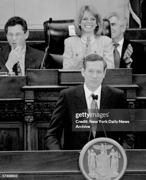 Speaker of the Assembly Sheldon Silver, left, listens while Republicans Lt. Gov. Betsy McCaughey and Senate Majority Leader Joe Bruno applaud Gov....