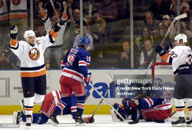 New York Islanders' Alexei Yashin celebrates his first period goal against New York Rangers' goaltender Henrik Lundqvist . The Islanders won, 3-2, at...