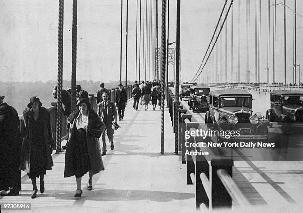 Pedestrians and motor traffic on George Washington Bridge two days after its official opening.