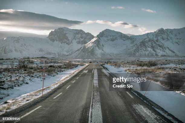 road at gimsøya island in the lofoten during winter - austvagoy stock pictures, royalty-free photos & images