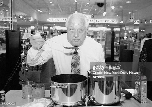 Tommy LaSorda gives a taste test to the pasta he served up at the grand opening of Stern's department store.