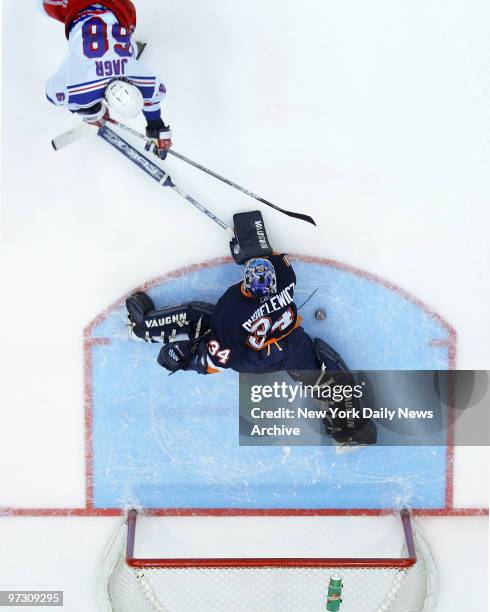 New York Islanders vs. New York Rangers at Nassau Coliseum. Islanders win 3-2 in shootout. New York Islanders goalie Wade Dubielewicz blocks shootout...