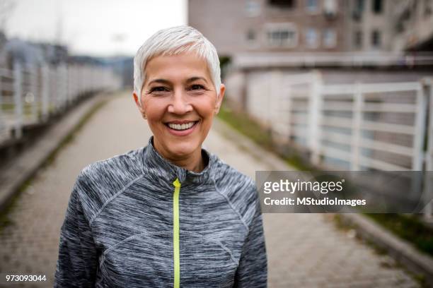portrait of a smiling mature woman - 50 54 years stock pictures, royalty-free photos & images
