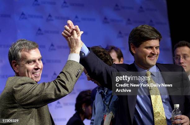 Gerald Levin , chairman and CEO of Time Warner Inc., and Steve Case, chairman and CEO of America Online, give each other a high five at news...