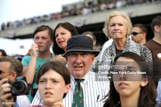Spectators react after Big Brown lost to Da'Tara in the 140th running of the Belmont Stakes.