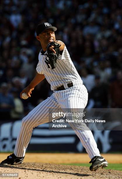 New York Yankees' reliever Mariano Rivera delivers home during the ninth inning to close out game against the Kansas City Royals at Yankee Stadium....