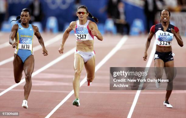 Tonique Williams-Darling of the Bahamas, Ana Guevara of Mexico and Sanya Richards of the U.S. Compete in the women's 400-meter race at the 2004...