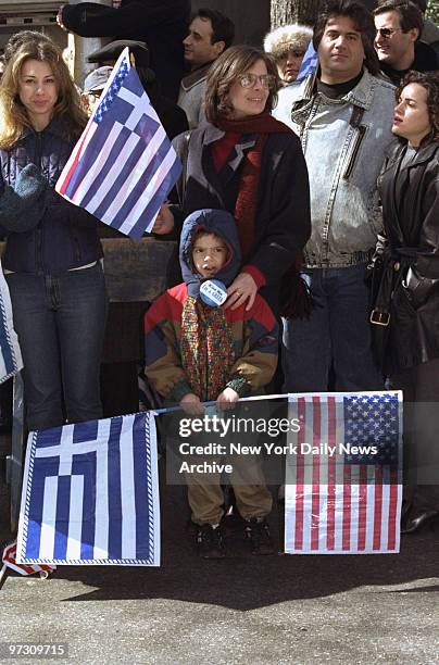 Spectators watch the Greek Independence Day Parade on Fifth Ave.