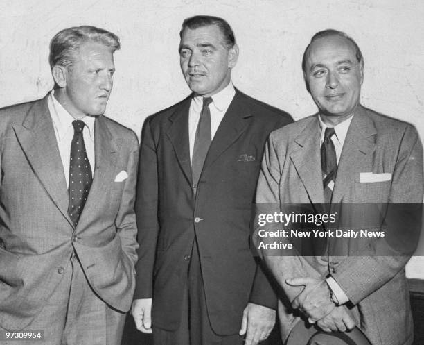 Spencer Tracy, Clark Gable and Charles Boyer arriving on the Queen Mary that docked at Pier 90.