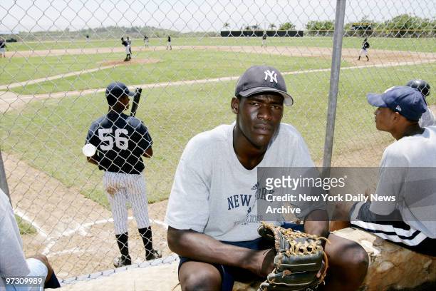 New York Yankees' pitching prospect Maximo Nelson takes a break from a workout at the Loma Del Sue?os Major League Baseball training complex, which...