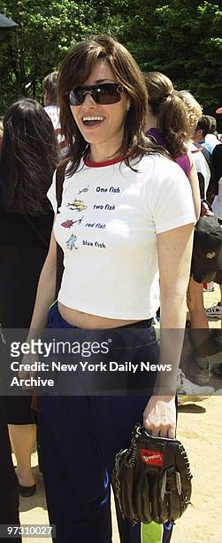 Gina Gershon seems to be in midseason form on arrival to play ball on opening day of the Broadway Cares/Equity Fights AIDS softball season in Central...