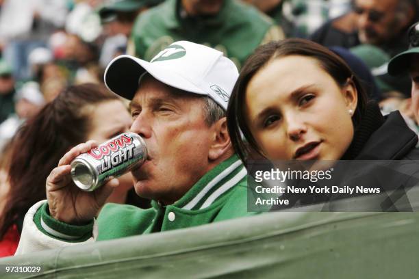 Mayor Michael Bloomberg enjoys a beer with his daughter Georgina during the New York Jets versus San Francisco 49ers football game at the Meadowlands.