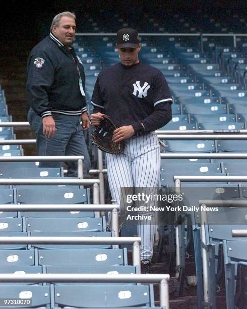 New York Yankees practice-- Andy Pettitte and his father Tommy in the stands during the Yankee workout Friday., Atlanta Braves vs. N.Y. Yankees....