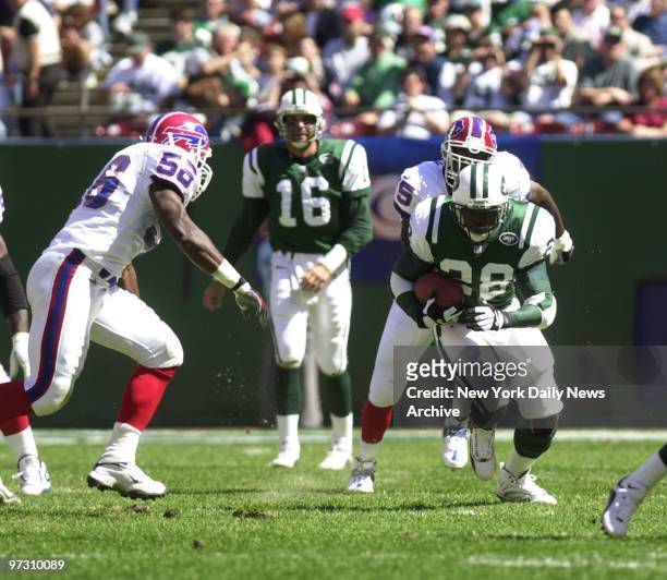 New York Jets' Curtis Martin finds a hole in the Buffalo Bills' defense in game at Giants Stadium.The Jets won, 27-14, giving them a 3-0 start on the...