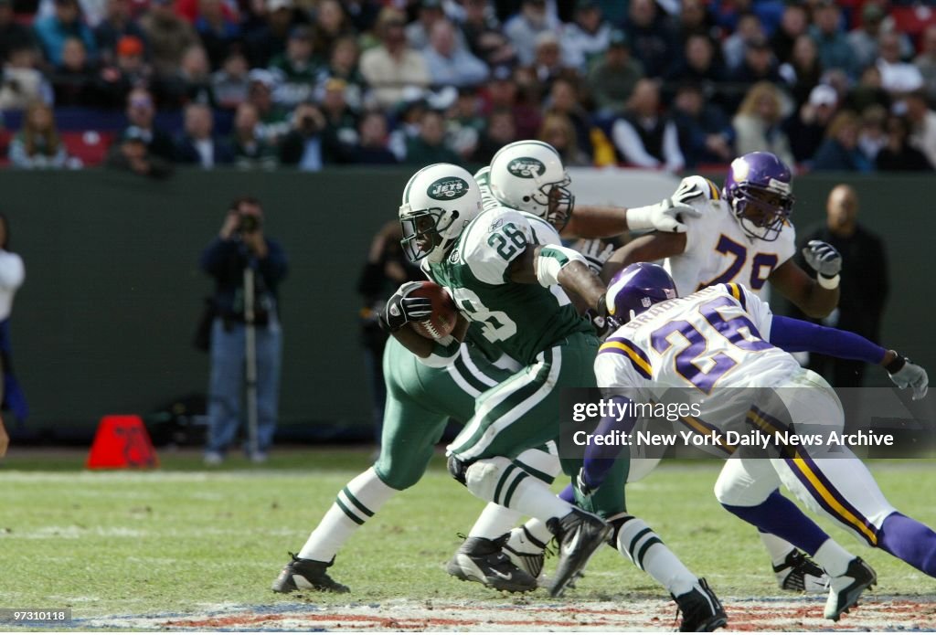New York Jets' Curtis Martin carries the ball past Minnesota