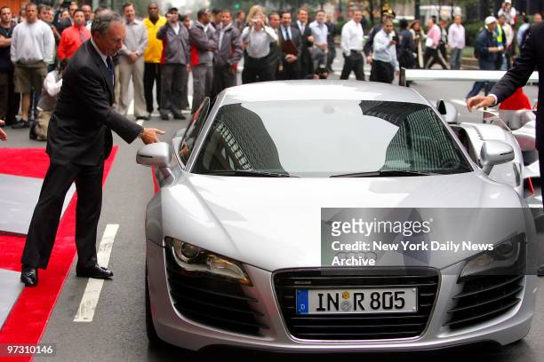 Mayor Michael Bloomberg gets out of a new Audi R8 sports car after riding down Park Ave. During the grand opening of the new Audi Forum at Park Ave....