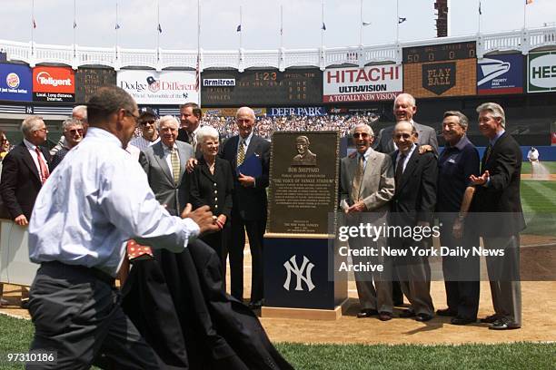 New York Yankees' public address announcer Bob Sheppard and his wife, Mary, stand to left of plaque unveiled in his honor at Yankee Stadium. Former...