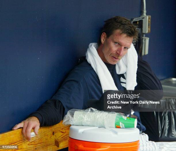 New York Yankees' Randy Johnson cools off in the dugout after practicing his pitching during a full squad workout at Legends Field, the Yanks' spring...