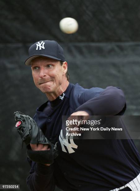 New York Yankees' Randy Johnson hurls a pitch during a full squad workout at Legends Field, the Yanks' spring training facility in Tampa, Fla.