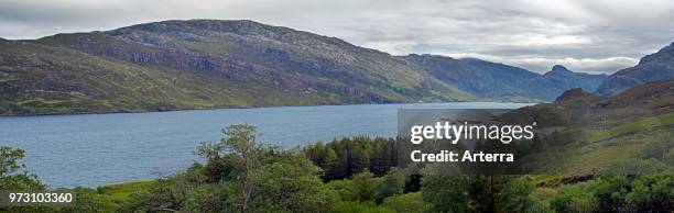 Glencoul Thrust on the Aird da Loch peninsula showing Cambrian quartzite sandwiched between layers of Lewisian gneiss in Scotland.