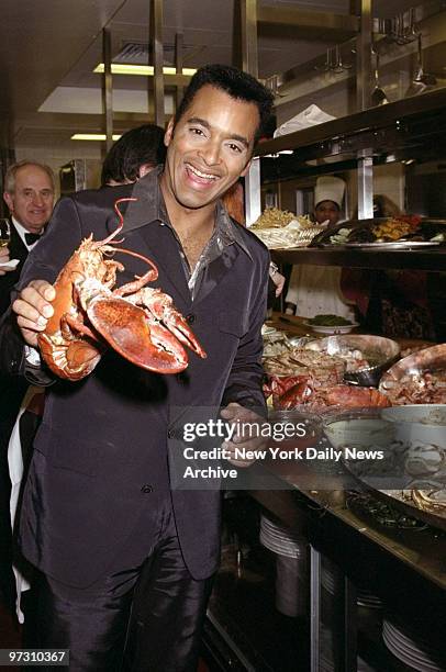 John Secada with lobster during "Secada" album release party at Four Seasons.