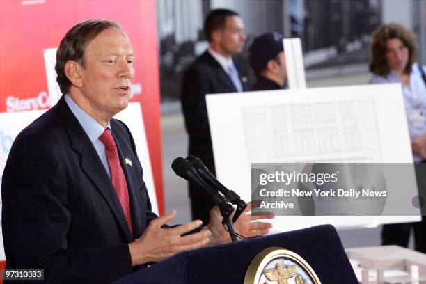 Gov. George Pataki speaks at a news conference at the World Trade Center Path Station announcing the construction of two temporary memorials for the...