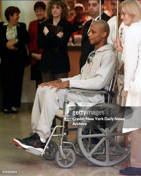 Darryl Strawberry leaves Columbia Presyterian Hospital in a wheelchair after being treated for colon cancer.
