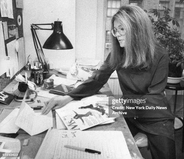 Gloria Steinem, feminist leader and founder of "Ms." magazine, at her desk.