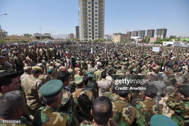 Peshmergas march to stage a protest after Iraqi Parliament decided to disannul IKRG's security forces' votes in front of Sulaymaniyah Governorate in...