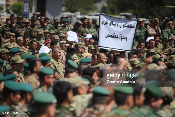 Peshmergas march to stage a protest after Iraqi Parliament decided to disannul IKRG's security forces' votes in front of Sulaymaniyah Governorate in...