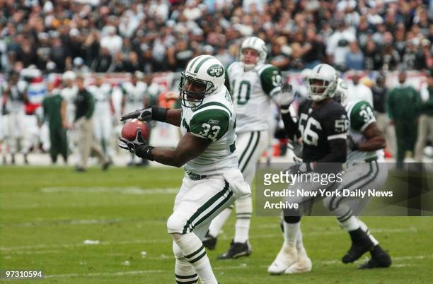 New York Jets' Jerald Sowell catches the ball and goes on to run it in to the end zone for the touchdown in the second quarter of the AFC divisional...