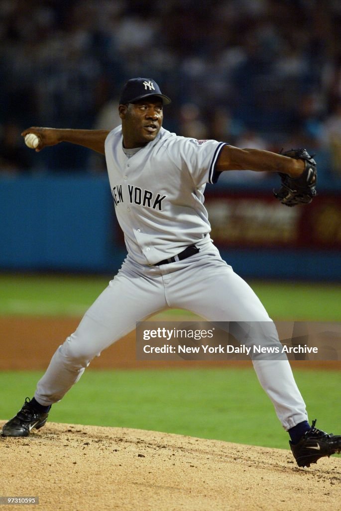 New York Yankees' reliever Jose Contreras hurls a pitch agai