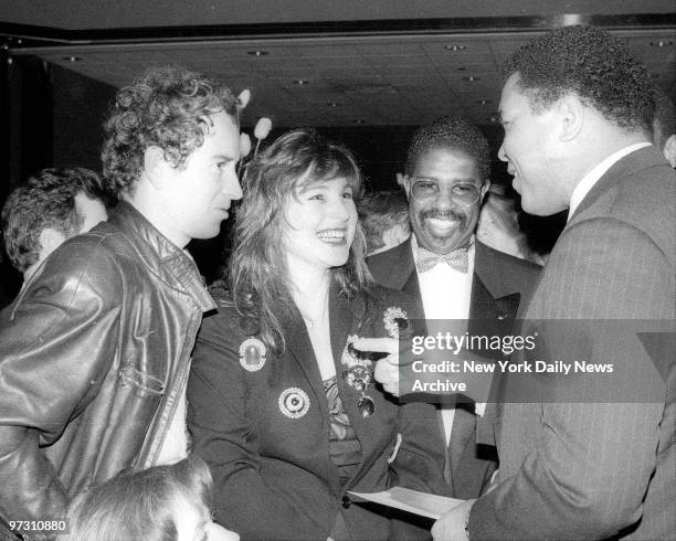 John McEnroe with wife, Tatum O'Neal gets details about the big fight from talkative Muhammad Ali, the retired heavyweight champion at ringside.