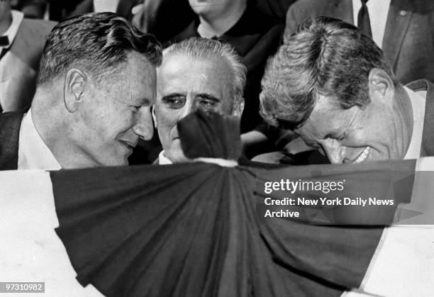 Gov. Nelson Rockefeller shares a laugh with President John F. Kennedy at Columbus Day Parade.