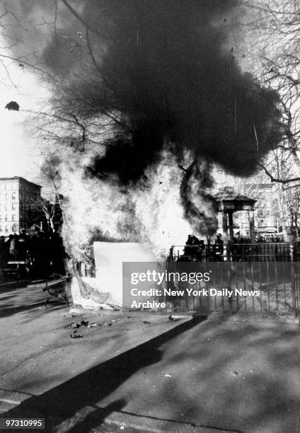 Squatters burn their prefab homes in Tompkins Square Park.