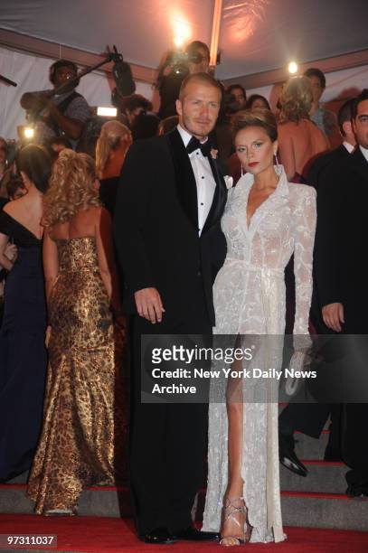 David and Victoria Beckham at the Costume Institute Gala celebrating Superheroes:Fashion and Fantasy .. And held at the Metropolitan Museum of Art