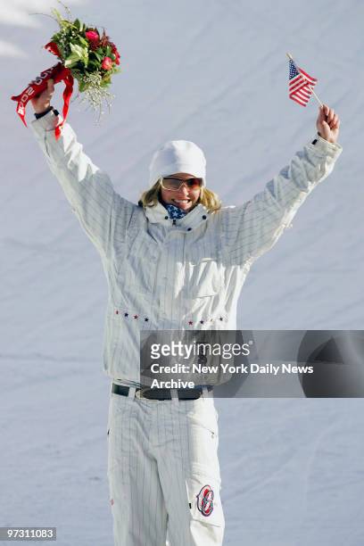 Gretchen Bleiler of the U.S. Celebrates winning the silver medal in the Women's Halfpipe Snowboard competition in Bardonecchia during the 2006 Winter...