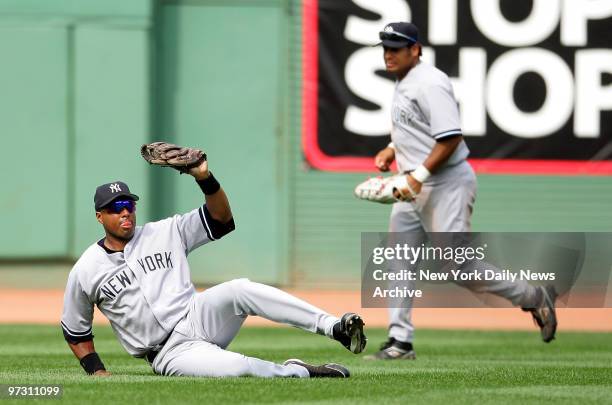New York Yankees' right fielder Bernie Williams makes a sliding catch on a fly ball hit by Boston Red Sox catcher Javy Lopez to end the fifth inning...