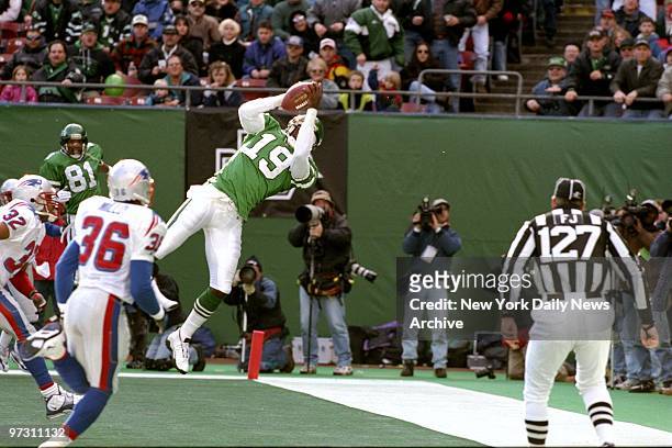 New York Jets' Keyshawn Johnson makes the catch near the end zone during game against the New England Patriots.