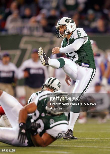 New York Jets' kicker Doug Brien watches the ball head towards the uprights for the game winner late in the fourth quarter against the Buffalo Bills...