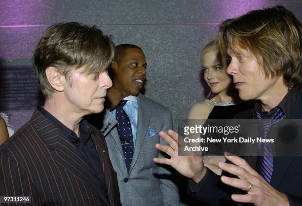 David Bowie talks with Kevin Bacon as Jay-Z chats with Nicole Kidman at a Vanity Fair party celebrating the fourth annual Tribeca Film Festival at...